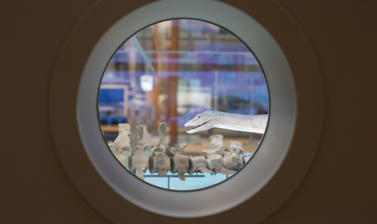Portholes in the Out of the Deep display allow visitors to peer into the scale models and fossil skeletons