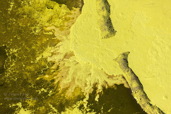 Sulfur waste pit at oil refinery by J Henry Fair